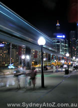 Sydney Monorail by night, Pyrmont Bridge.
